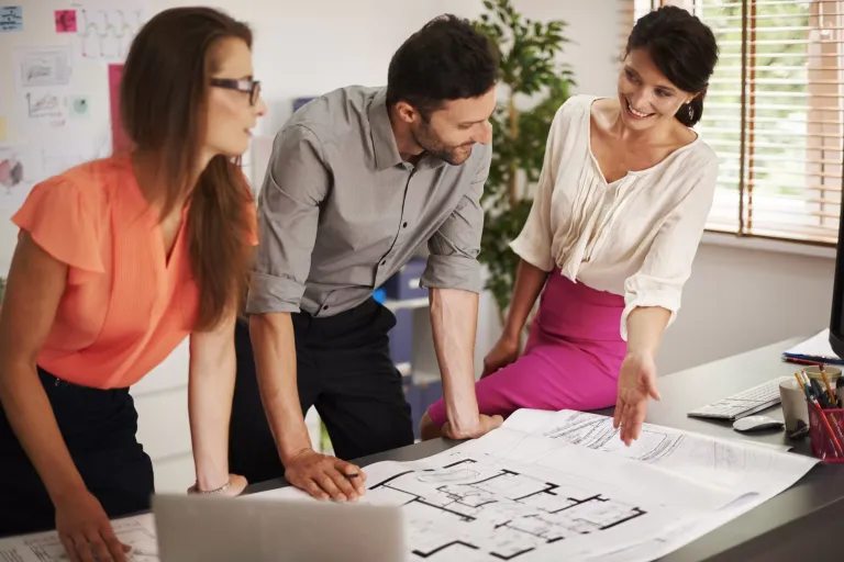 Interior Design Consultancy % a group of three people having discussion related to some designs